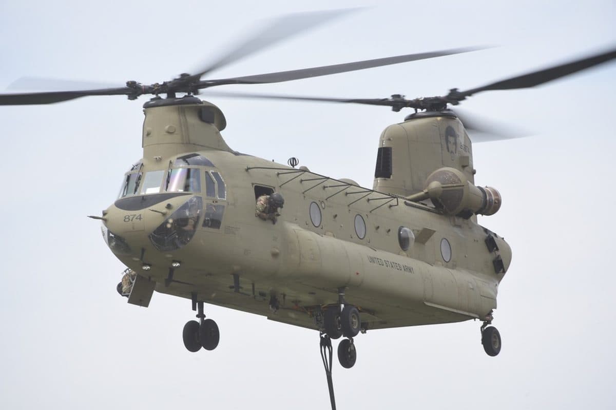 Boeing CH-47 Chinook heavy-lift helicopter carrying a sling load