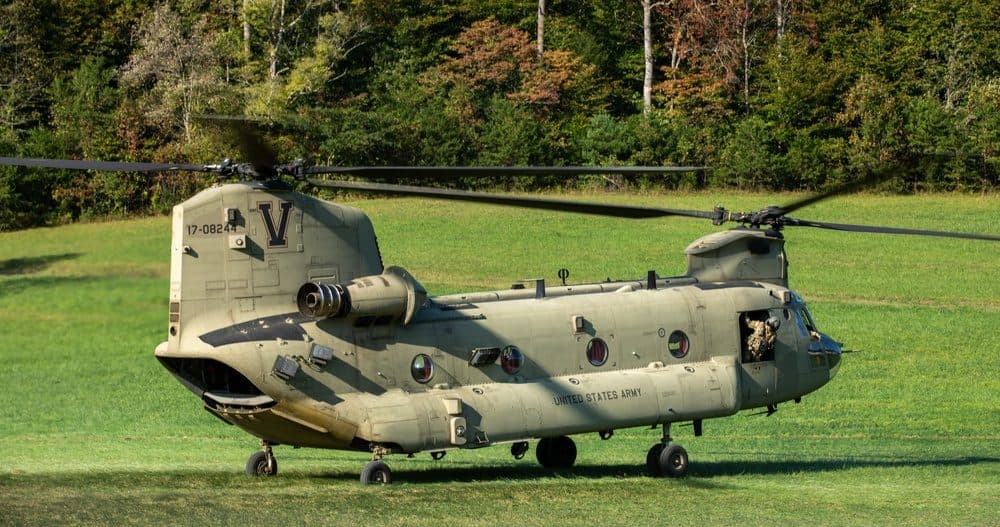 U.S. Army CH-47 Chinook helicopter and crew preparing for takeoff at a field site in North Carolina