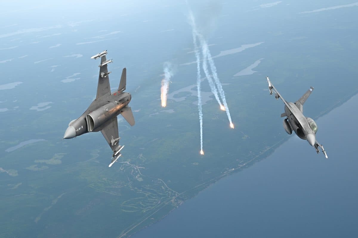 Two F-16 Fighting Falcons from the 148th Fighter Wing dispensing flares as infrared countermeasures during a training flight