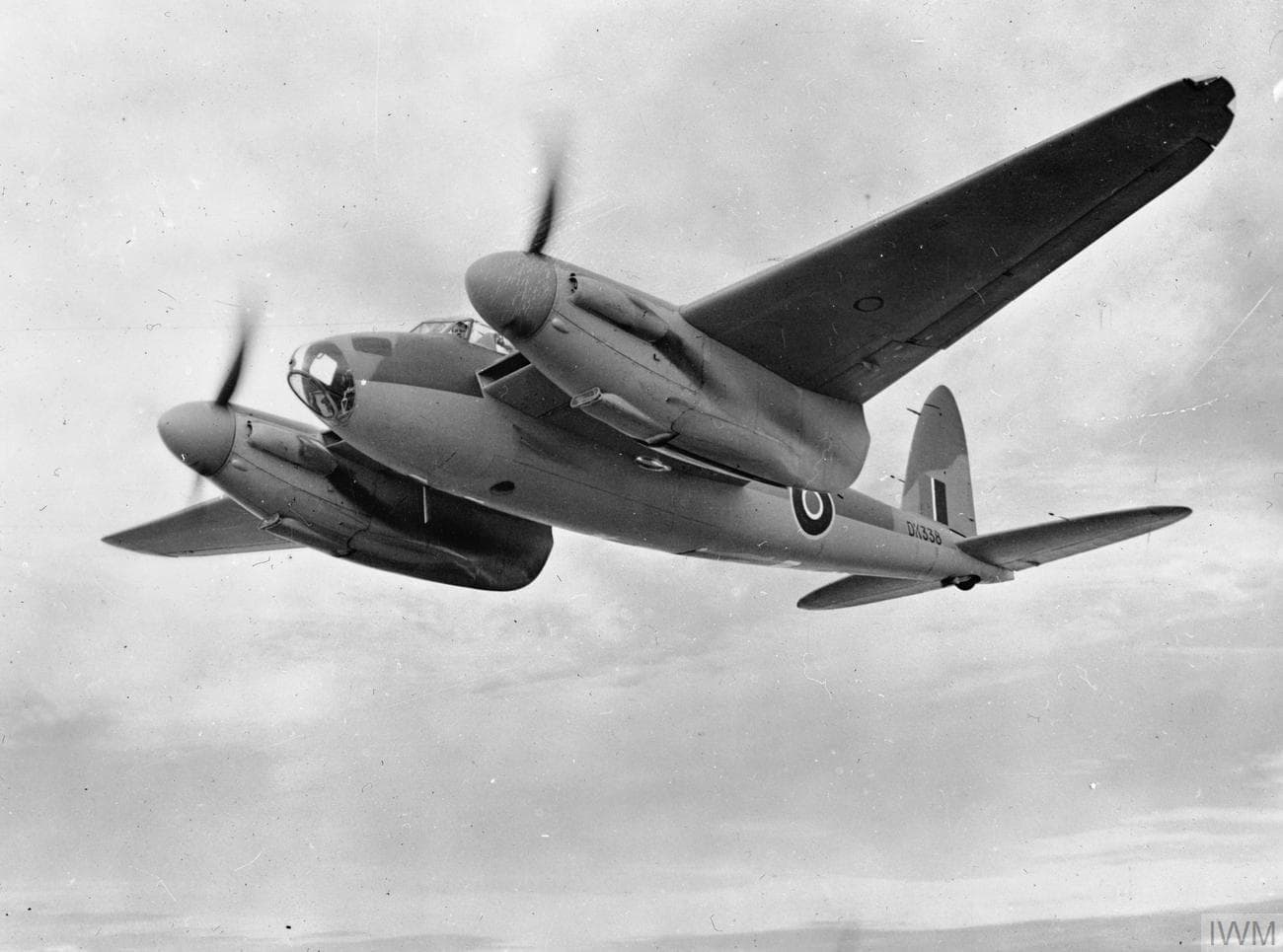 De Havilland Mosquito twin-engine aircraft in flight showing its sleek wooden construction and twin Merlin engines