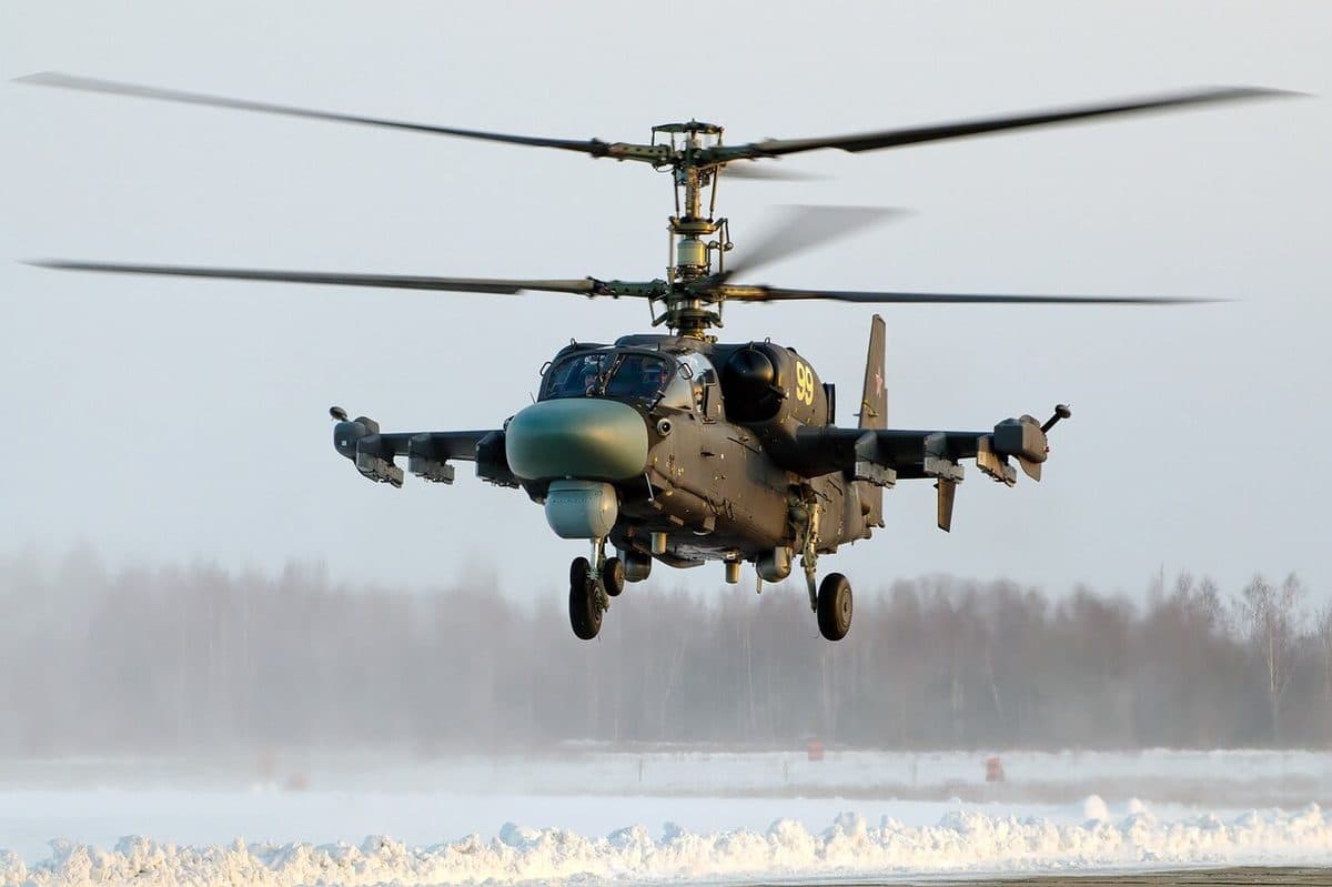 Kamov Ka-52 Alligator attack helicopter in flight showing its coaxial rotor system and side-by-side cockpit