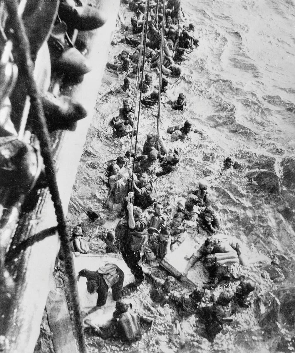 The German battleship Bismarck under fire and sinking in the North Atlantic
