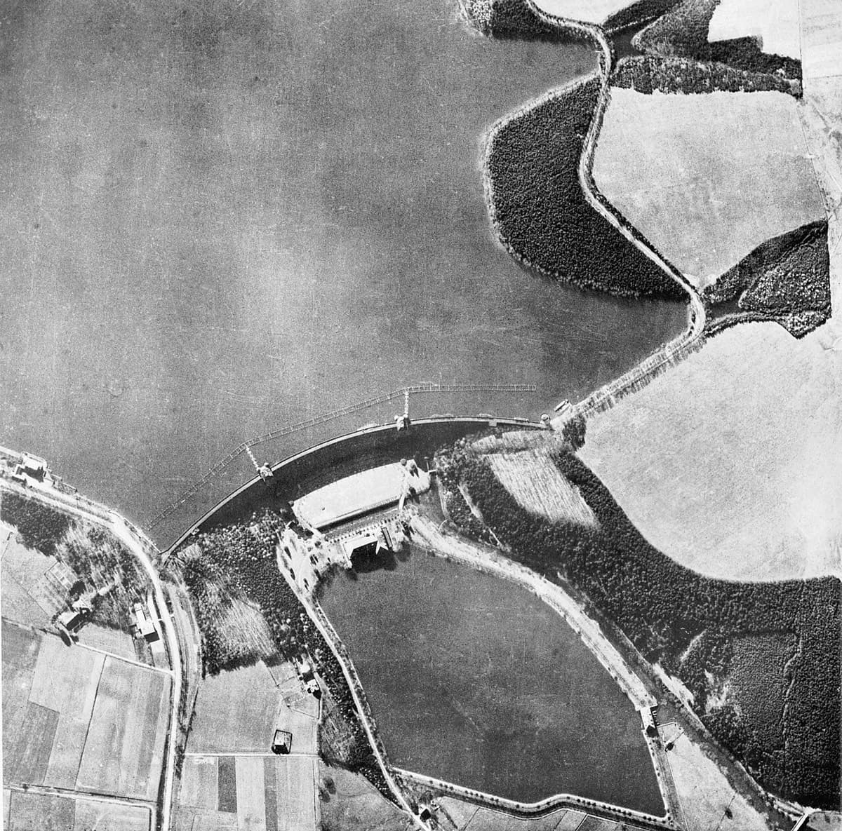RAF Lancaster bomber during the Dambusters Raid, flying low over water to deliver Barnes Wallis's bouncing bomb