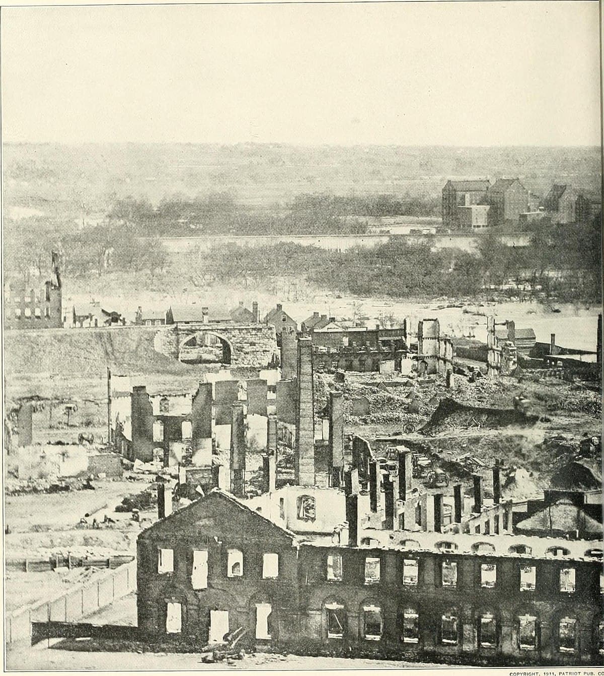Ruins of Richmond, Virginia, after the evacuation fire of April 1865, with the Capitol building visible in the background