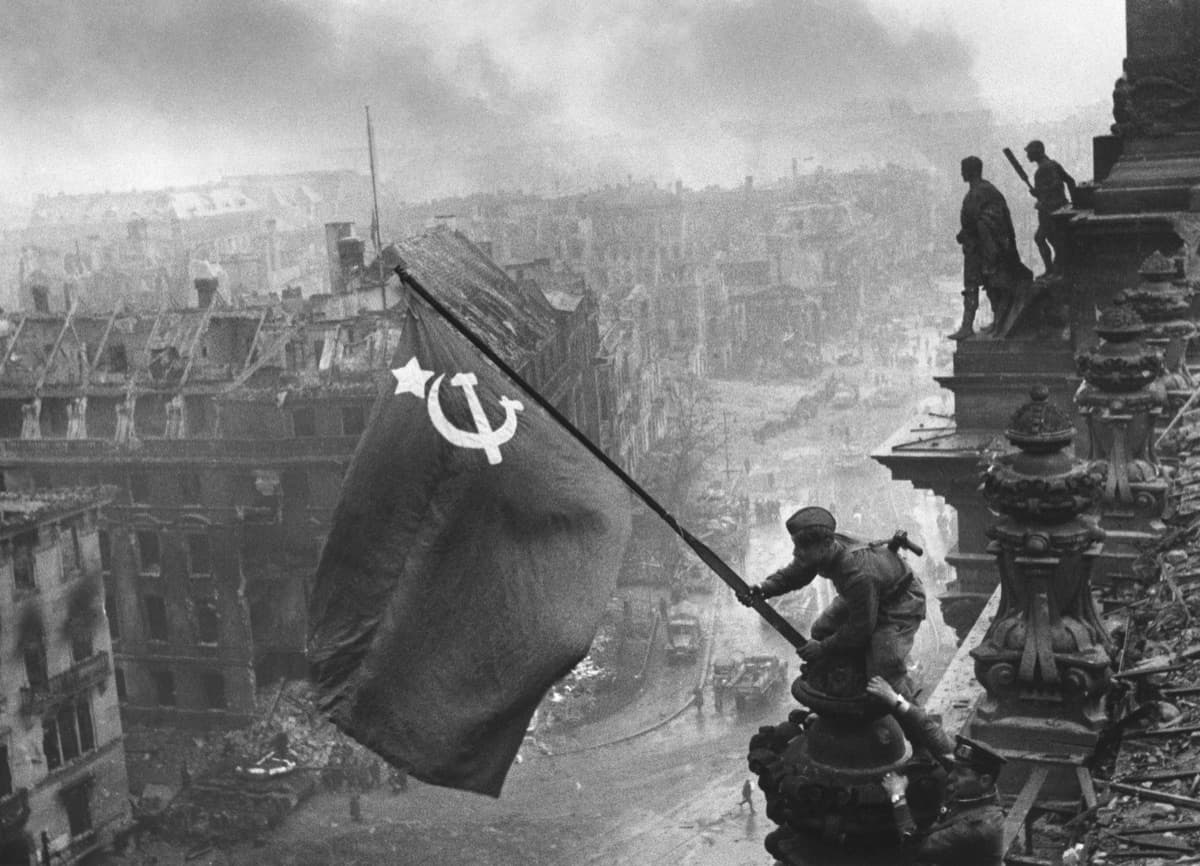 Soviet soldiers raising the red flag over the ruins of Stalingrad after the German surrender