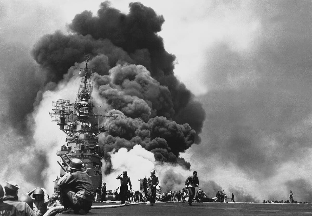 A kamikaze aircraft diving toward a US Navy ship off Okinawa in 1945