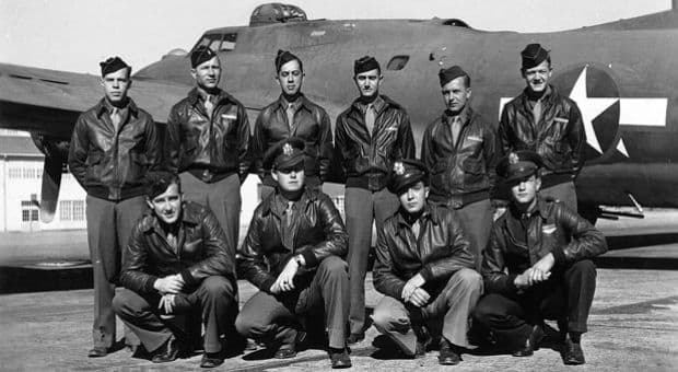 Ten-man crew of a B-17 Flying Fortress posed in front of their aircraft