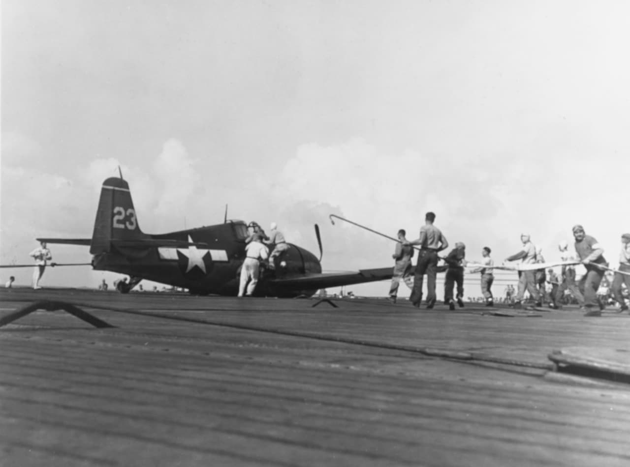 Damaged F6F Hellcat of VF-15 after crash landing on USS Essex, demonstrating the aircraft's rugged construction