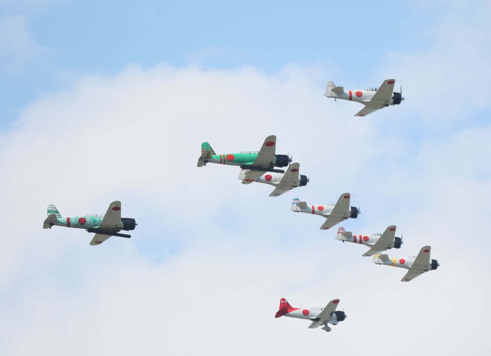 Japanese naval aircraft including A6M Zeros in formation flight during a strike mission