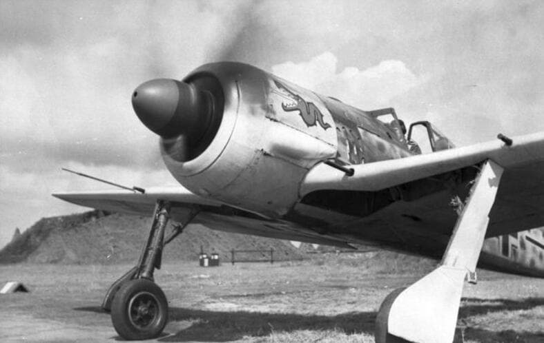 Focke-Wulf Fw 190A on a Luftwaffe airfield with propeller spinning and nose art visible