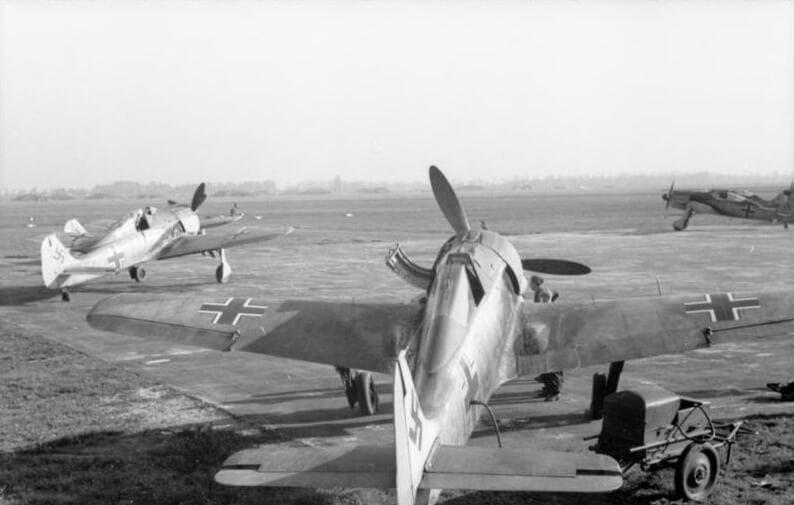 Focke-Wulf Fw 190As parked on a Luftwaffe airfield with distinctive tight engine cowlings visible