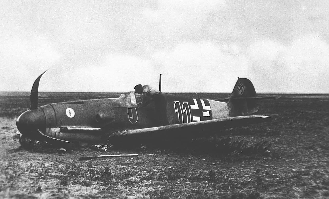 Bf 109 after a forced landing in southern Russia, showing battle damage