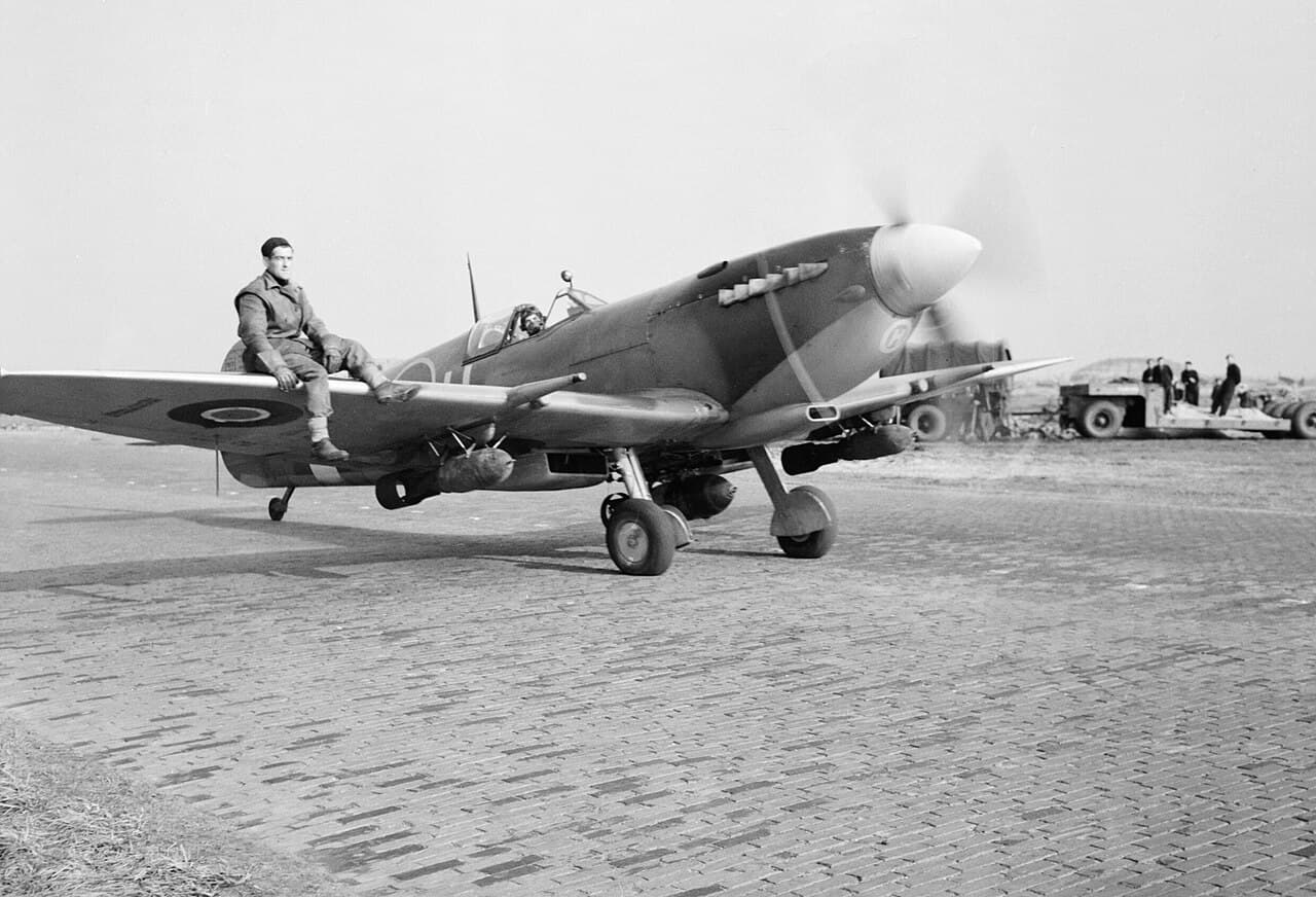 Spitfire Mk IXE of 412 Squadron RCAF armed with bombs taxiing at Volkel, Holland, October 1944