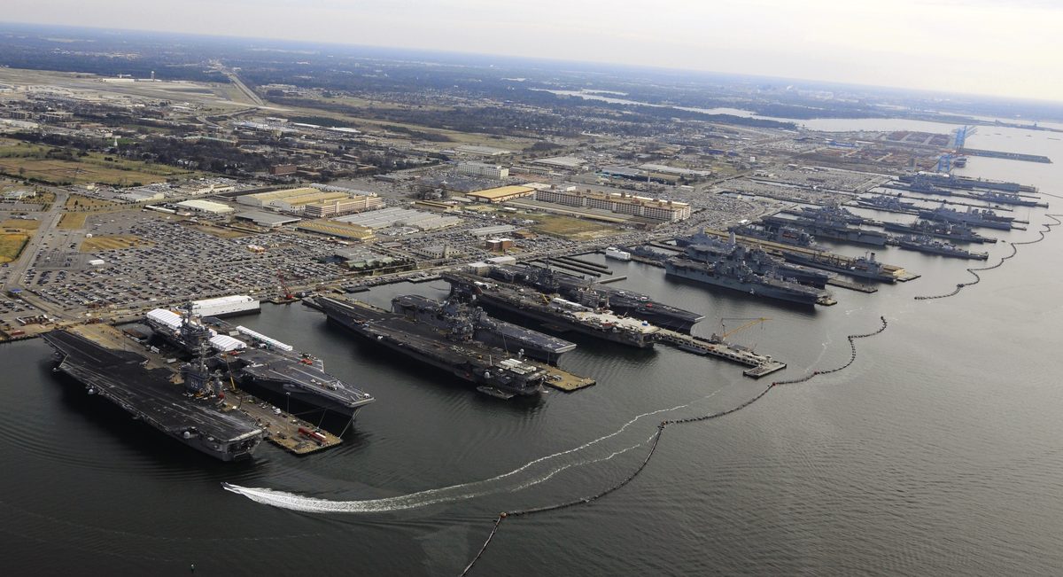 Aerial view of Naval Station Norfolk in Virginia showing aircraft carriers and warships at port