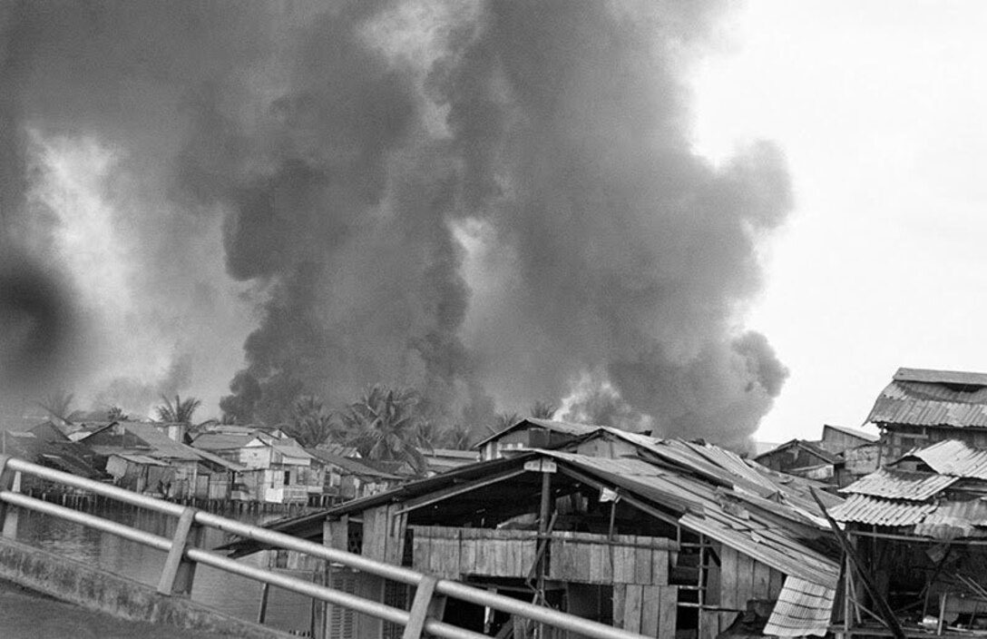 US Marines moving through the ruined streets of Hue Vietnam during the 1968 Tet Offensive