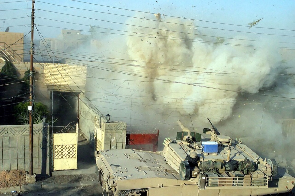 M1A1 Abrams tank advancing through the streets of Fallujah Iraq in 2004