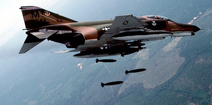 F-4 Phantom II launching from an aircraft carrier with afterburners lit