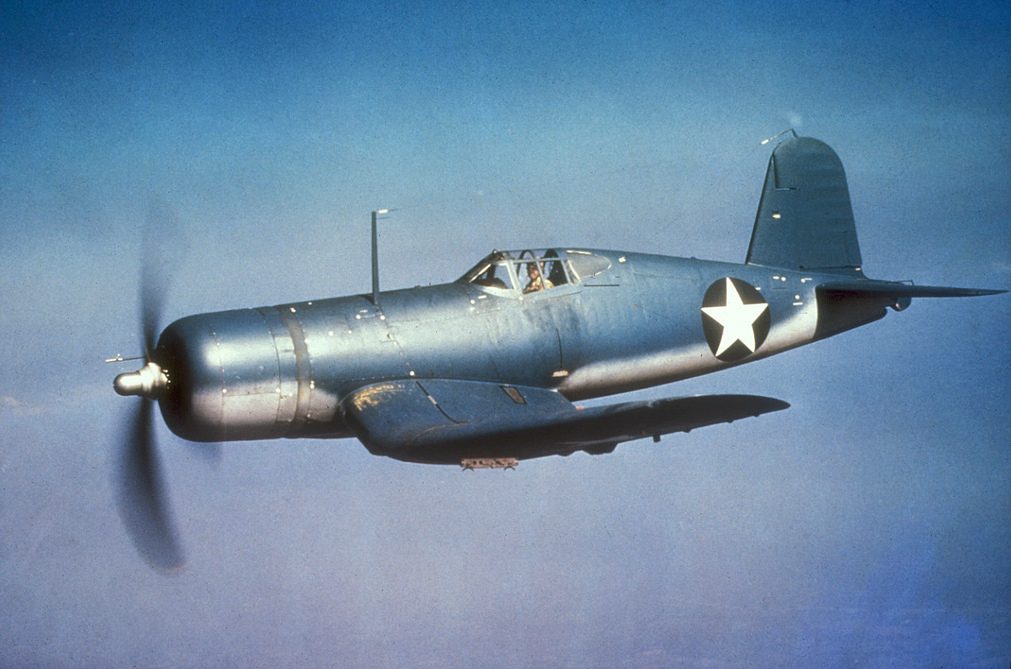 F4U Corsair with distinctive inverted gull wings in Pacific theater markings
