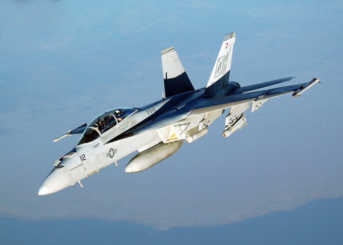 F/A-18E Super Hornet launching from aircraft carrier with steam catapult