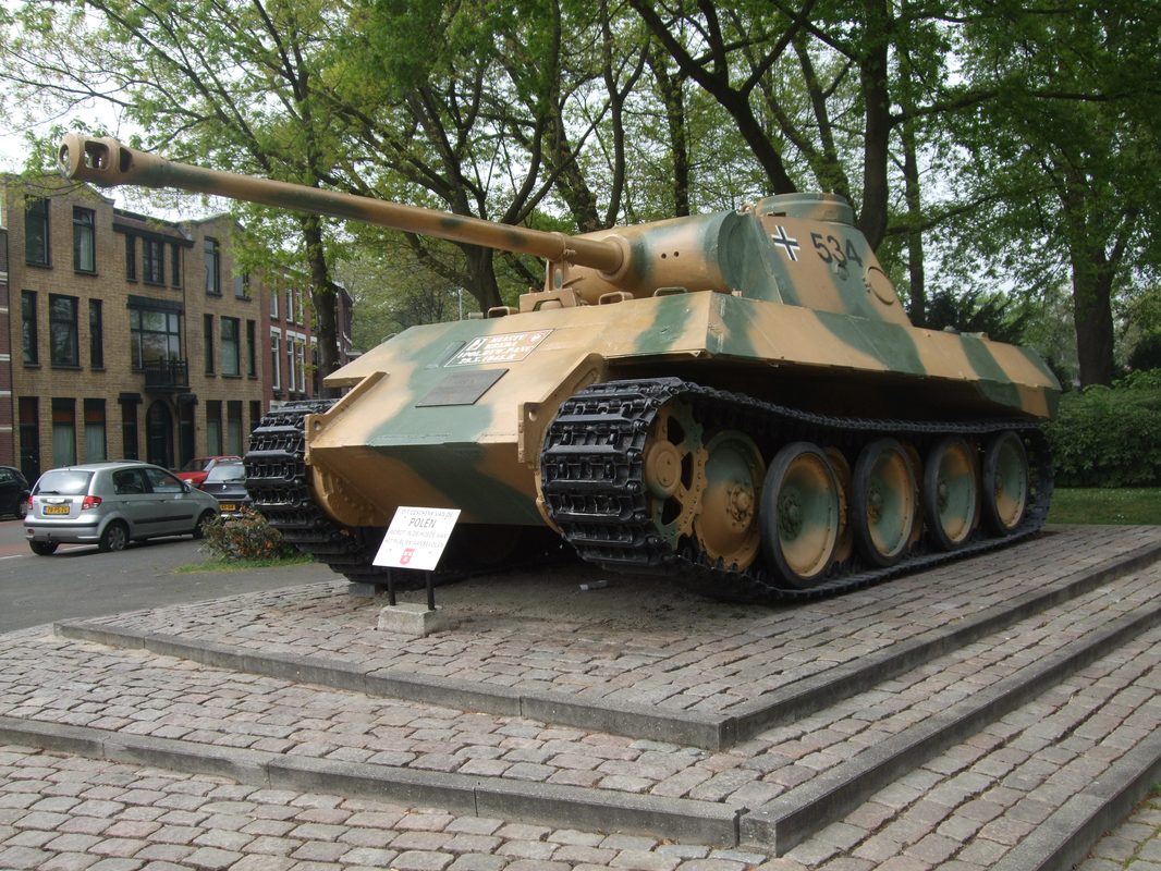 German Panther medium tank with sloped armor advancing through European terrain during WWII