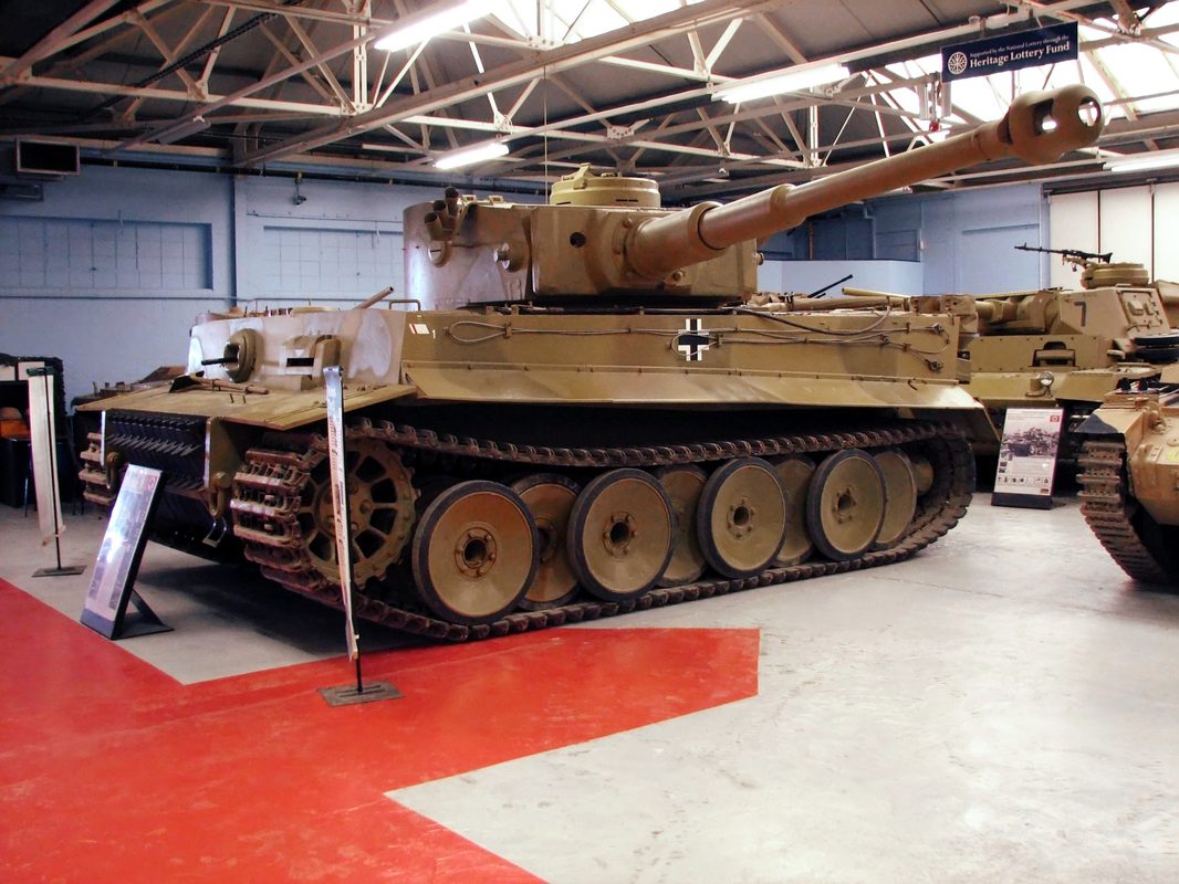 German Tiger I heavy tank with its iconic flat-sided turret and 88mm gun in combat during WWII