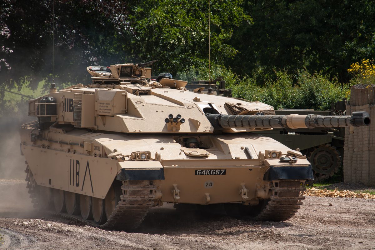 British Challenger 1 main battle tank advancing through Iraqi desert during Operation Desert Storm