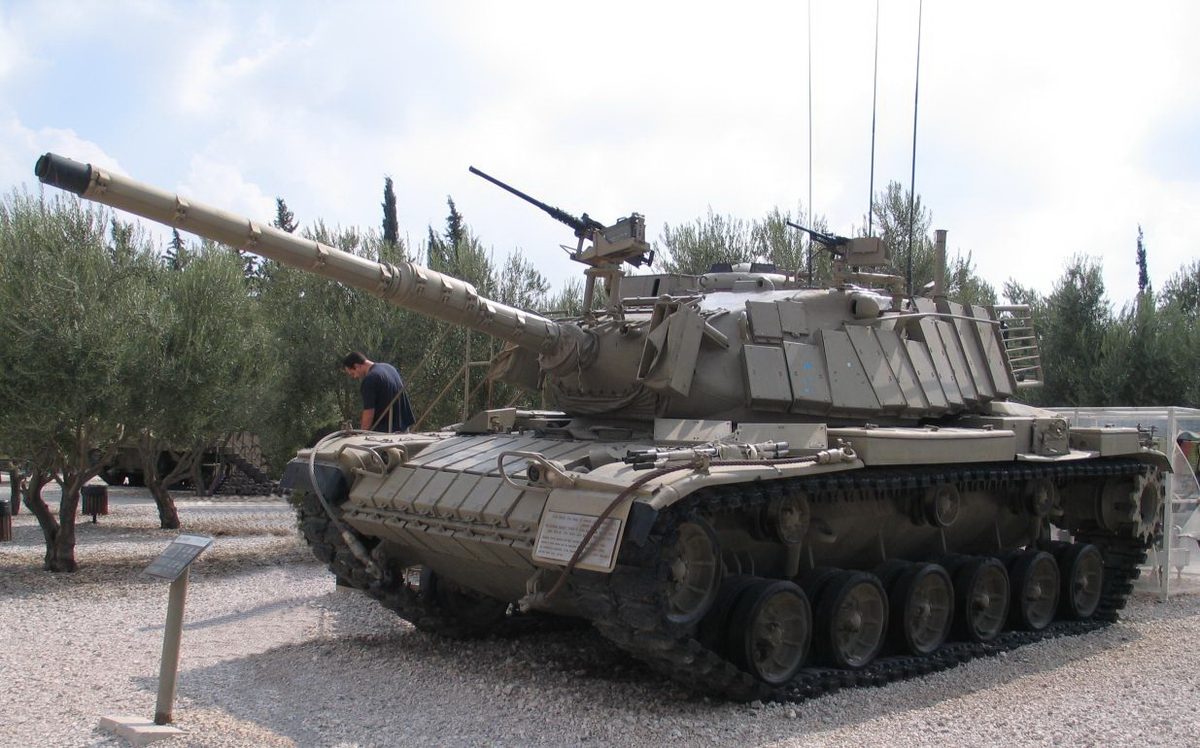 Israeli Magach tank with Blazer ERA in desert combat during Middle Eastern conflict