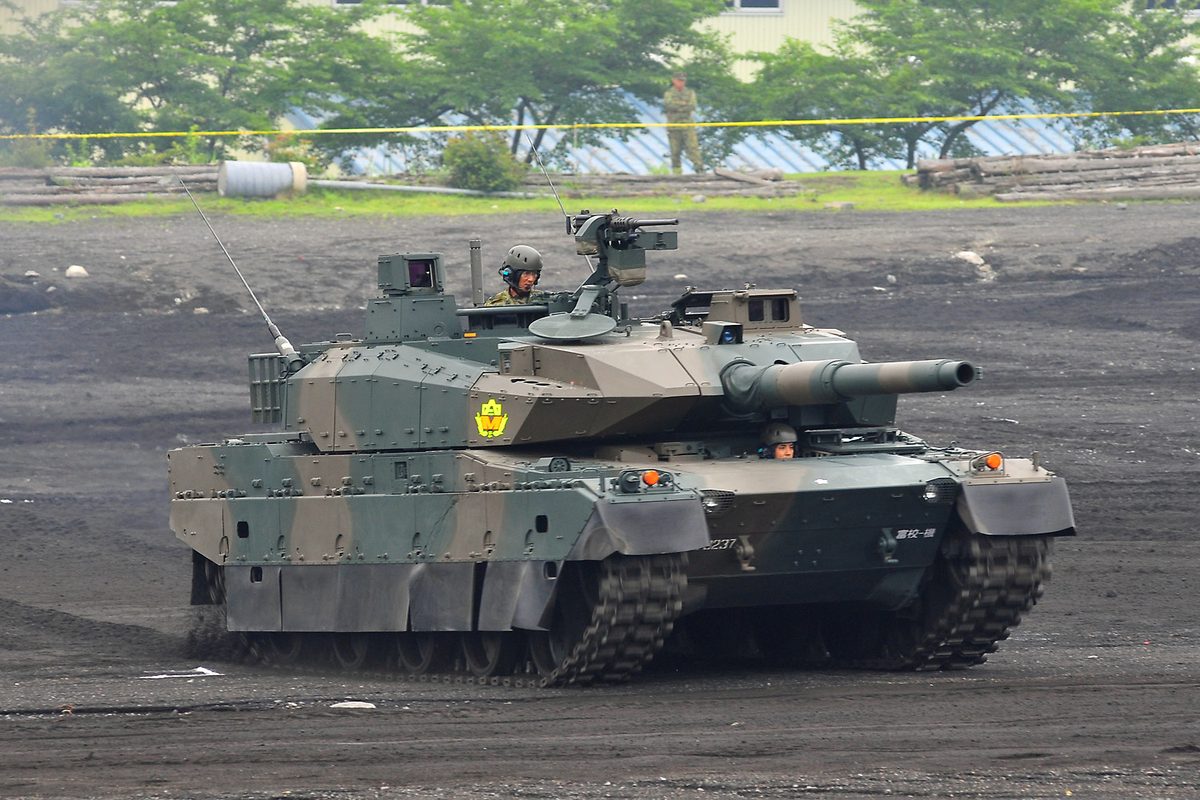 Japanese Type 10 main battle tank with modular armor at speed on a test track