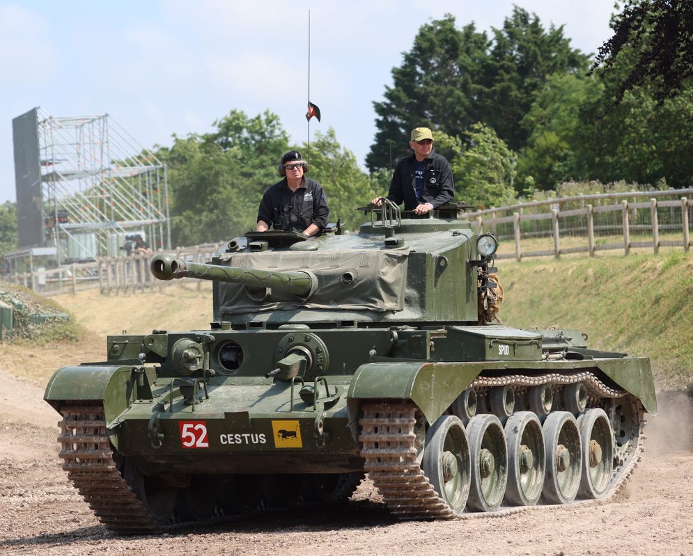 British Comet tank with its distinctive 77mm gun advancing through European countryside