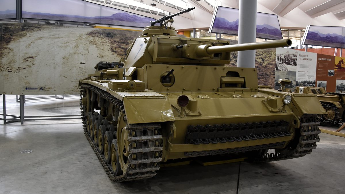 German Panzer III medium tank advancing across open terrain during World War II