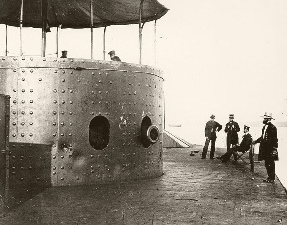 USS Monitor ironclad with its distinctive rotating turret in Hampton Roads