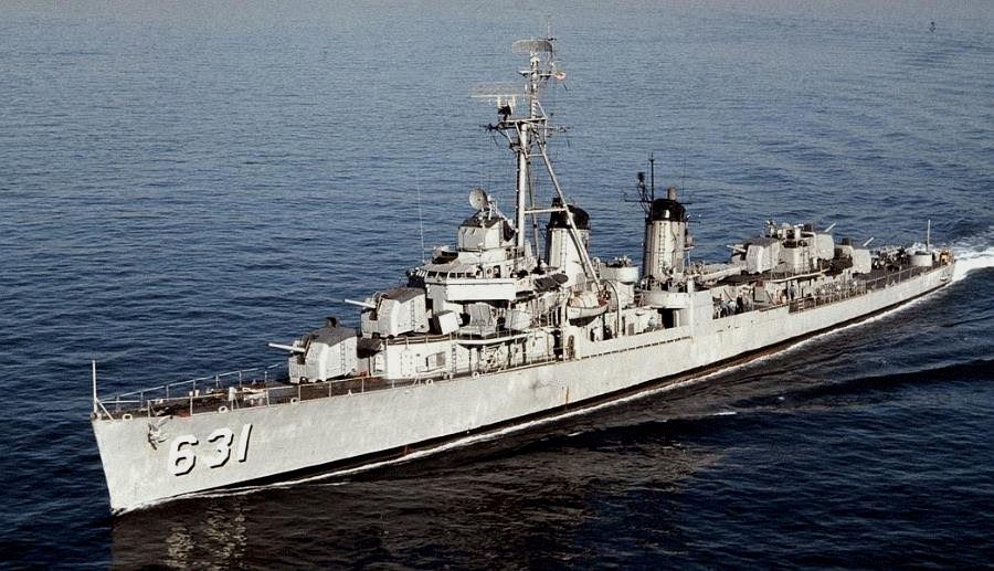 Fletcher-class destroyer cutting through Pacific waters during World War II