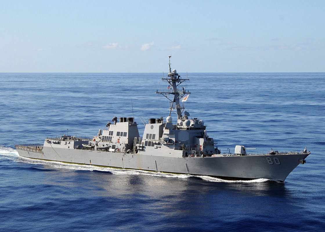Arleigh Burke-class guided missile destroyer at sea with Aegis radar arrays visible