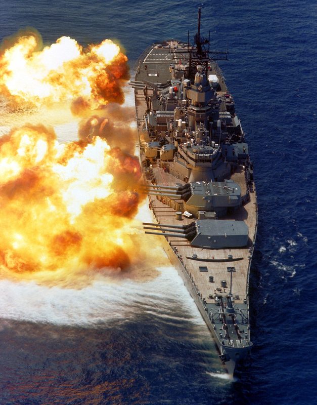 Iowa-class battleship firing a broadside from its nine 16-inch guns