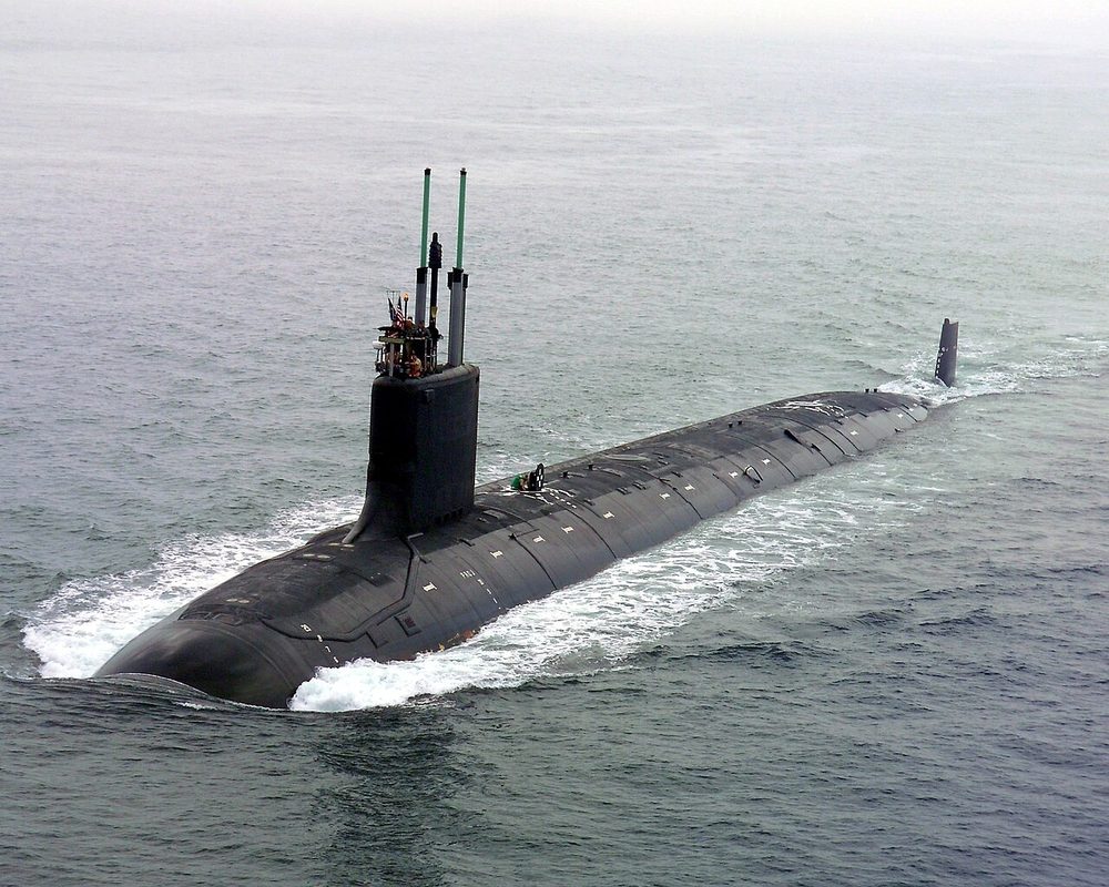Virginia-class nuclear attack submarine surfacing at sea