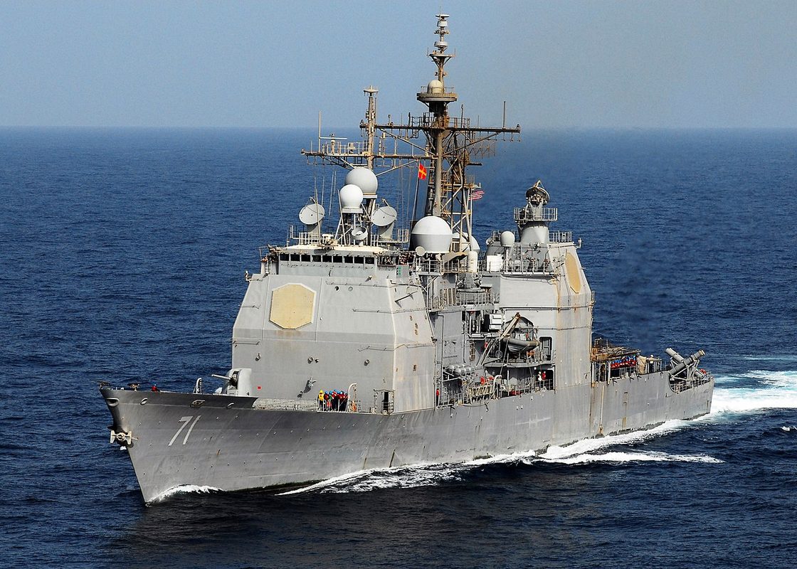 Ticonderoga-class guided missile cruiser launching a missile at sea