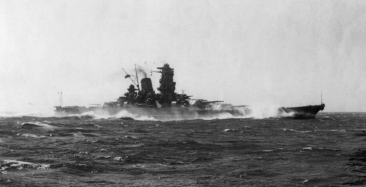 Japanese battleship Yamato underway at sea showing massive bow and triple turrets