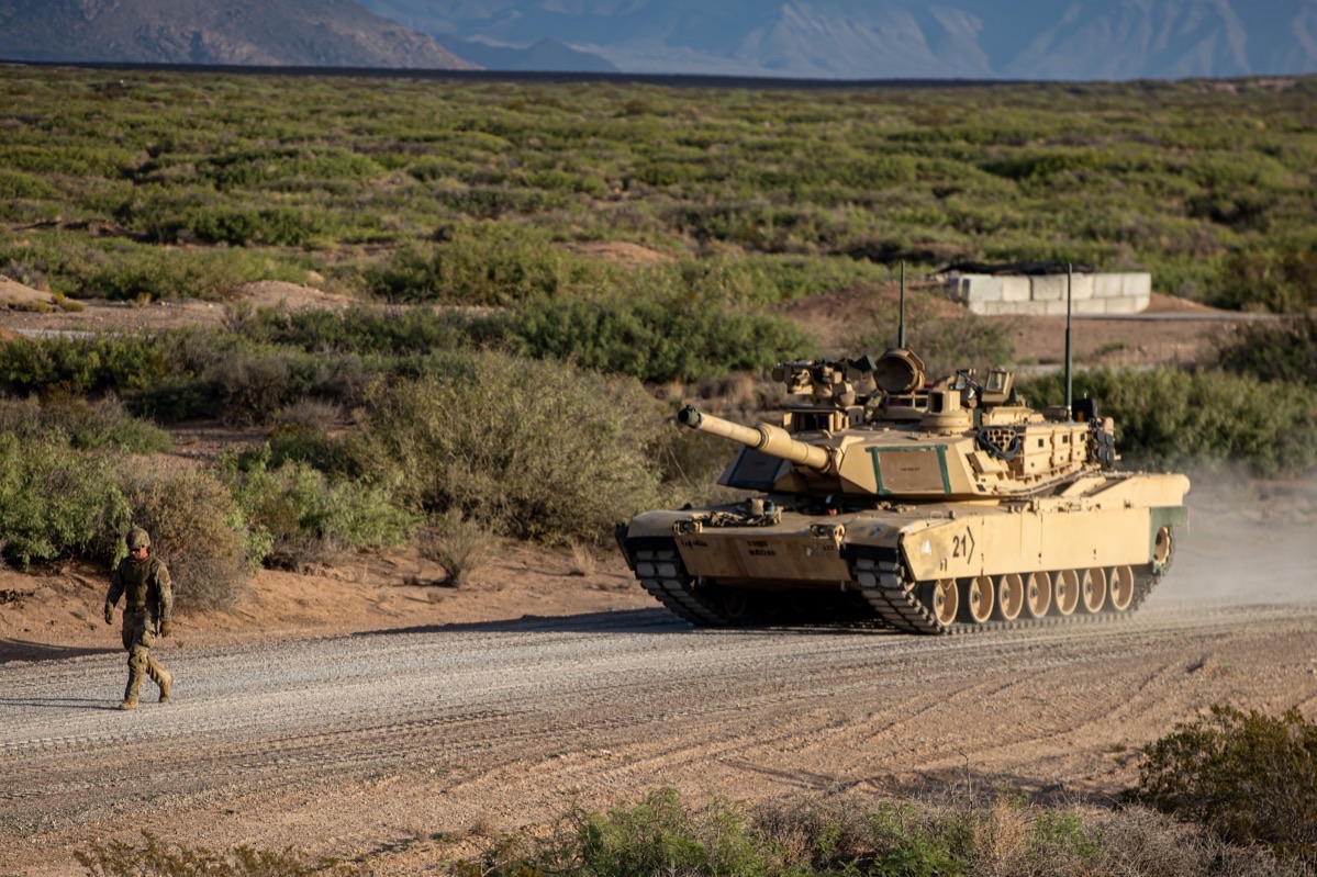 M1 Abrams crew training on emergency evacuation procedures showing the crew hatches and hull escape hatch