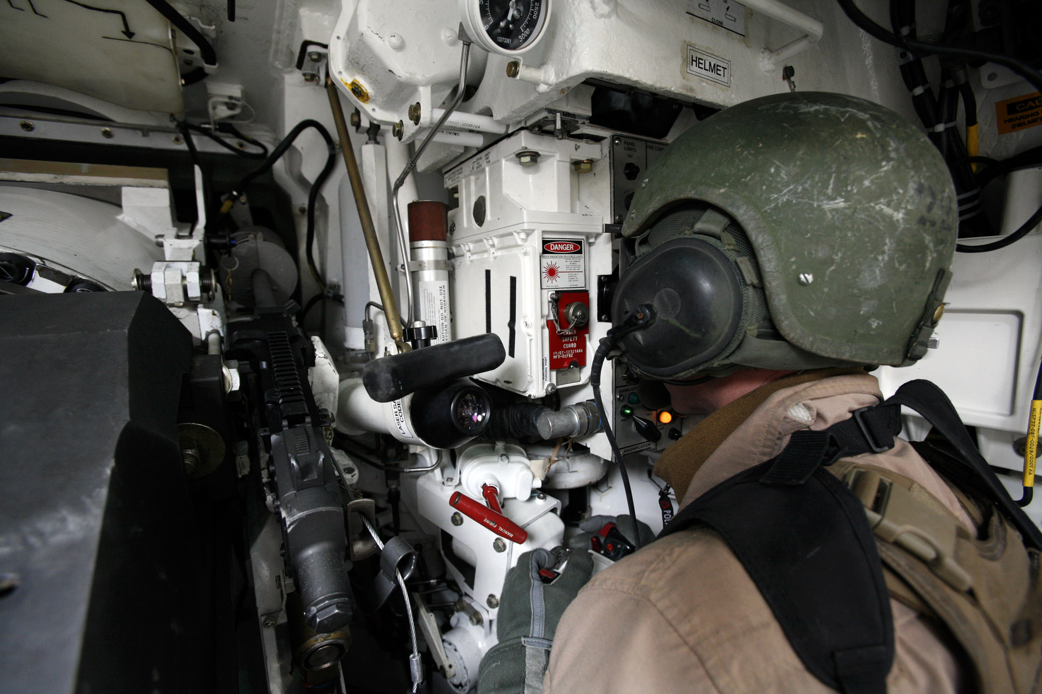 M1A1 Abrams tank commander scanning through thermal sights during desert operations