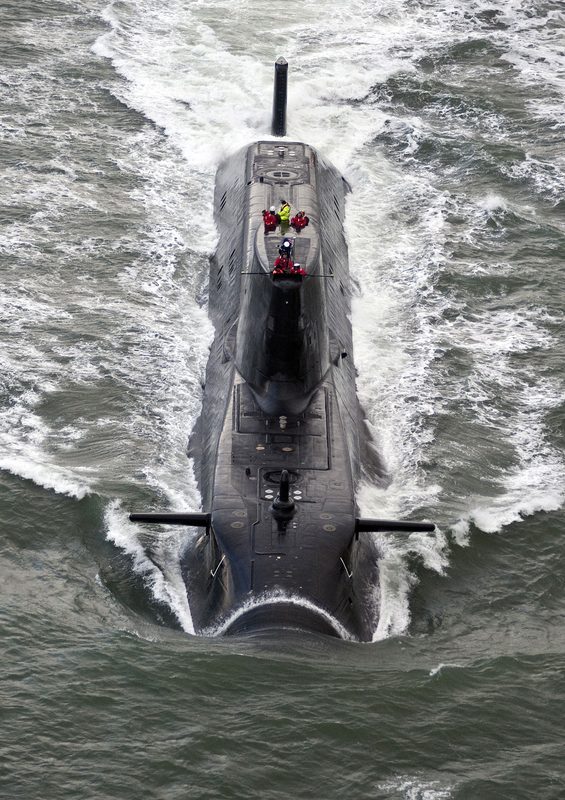 HMS Astute nuclear submarine on the surface with crew on the casing viewed from above
