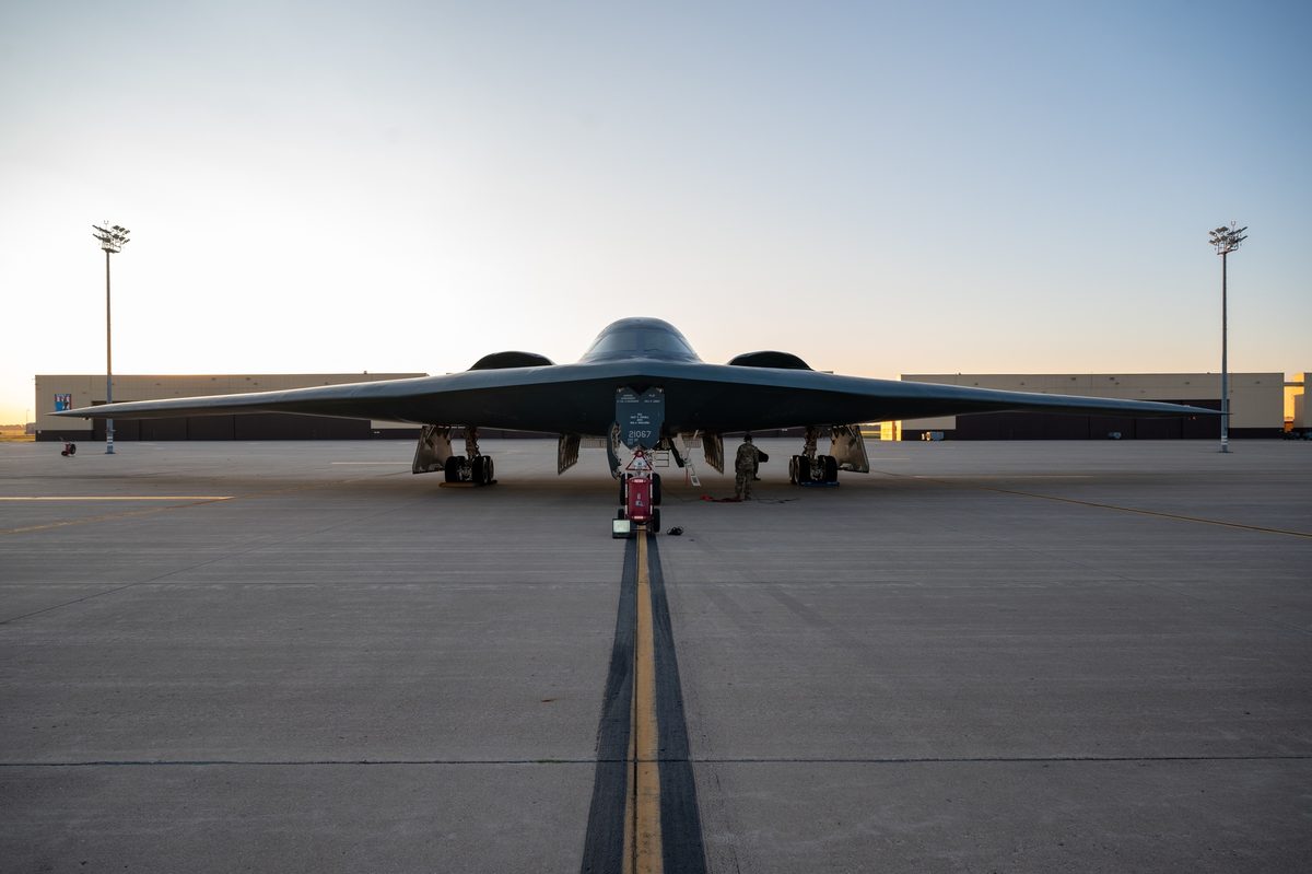Maintenance crew working on a B-2 Spirit stealth bomber at Whiteman Air Force Base