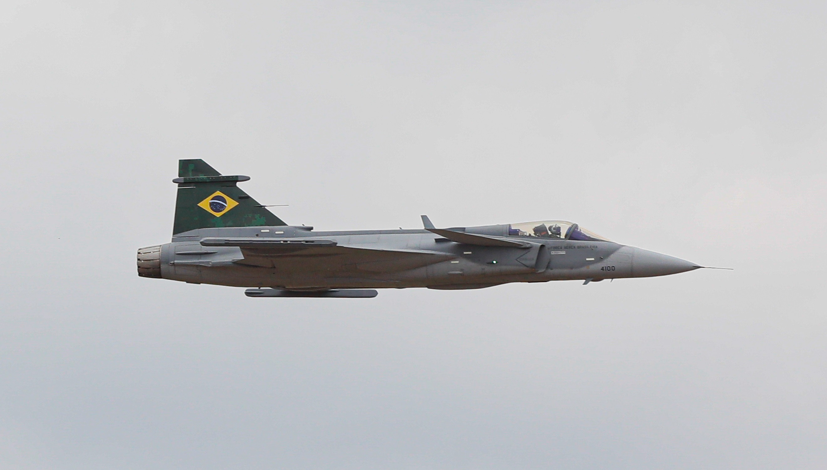 Saab JAS 39 Gripen E in flight over Swedish countryside