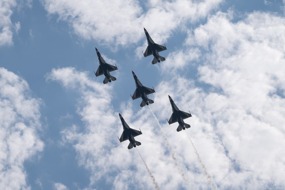 U.S. Air Force Thunderbirds F-16 Fighting Falcons fly in tight formation during an air show