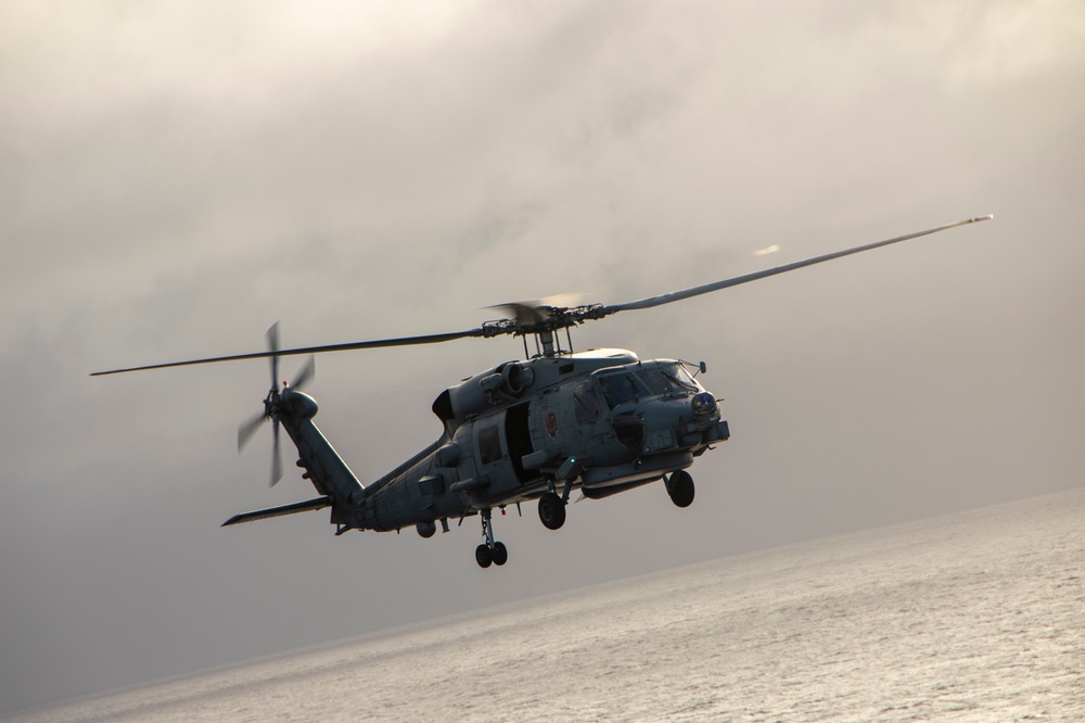 MH-60R Seahawk helicopter conducting anti-submarine warfare operations