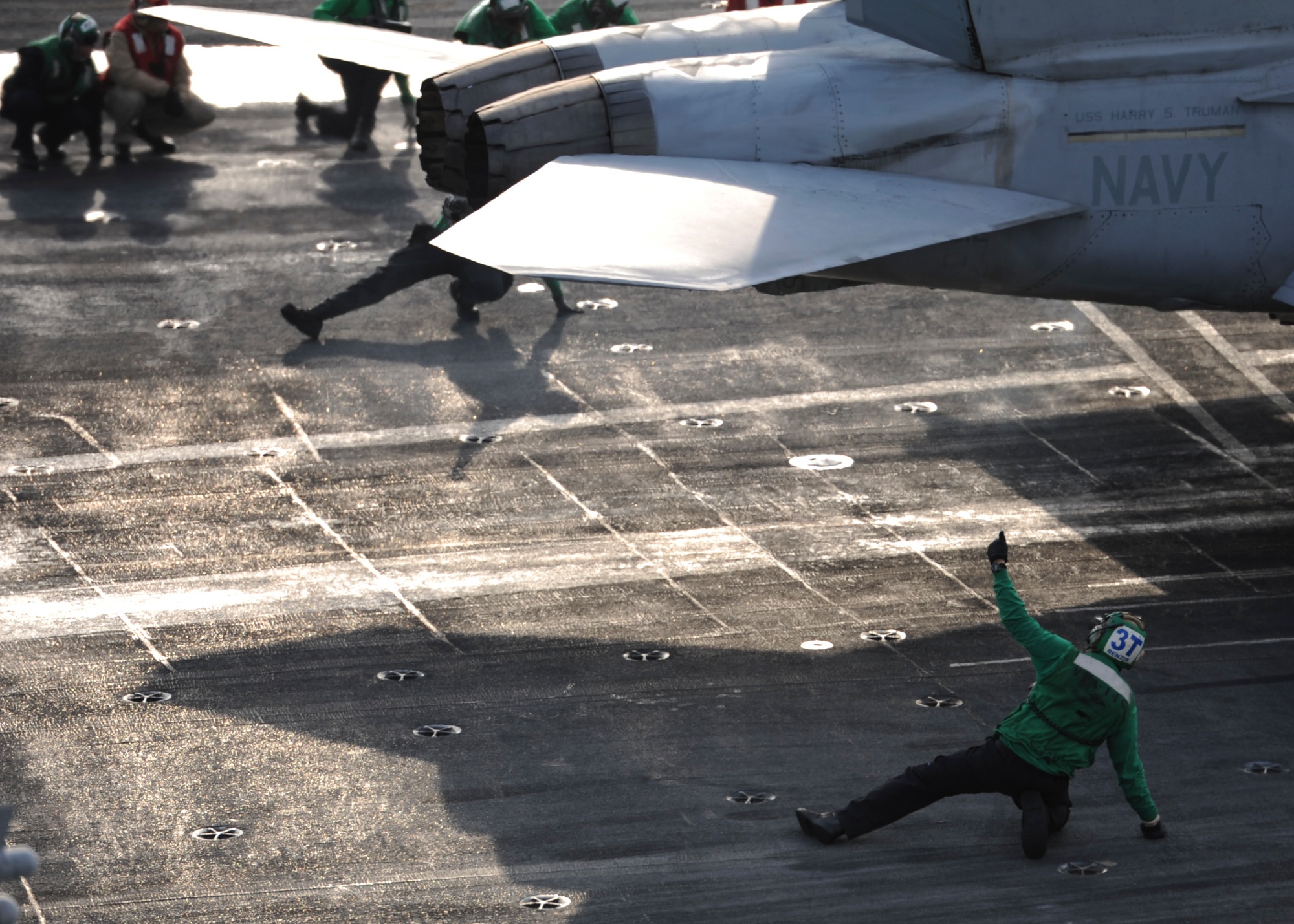 U.S. Navy aircraft carrier conducting flight operations in the open Pacific Ocean