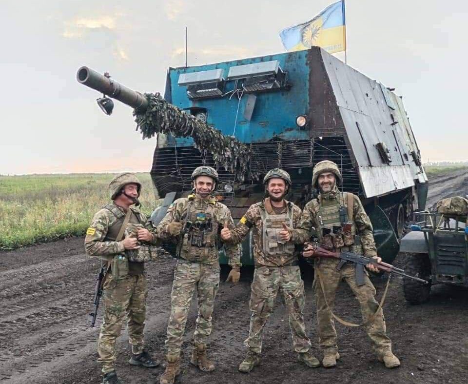 Russian tank with improvised cage armor and metal sheeting designed to protect against FPV drone attacks