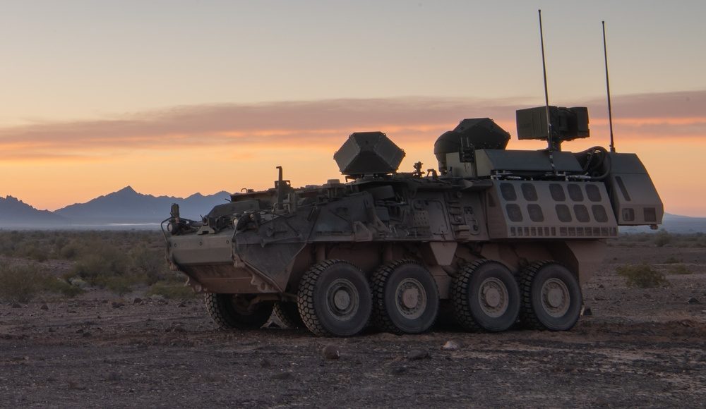 Close-up view of a directed energy weapon system mounted on a military vehicle