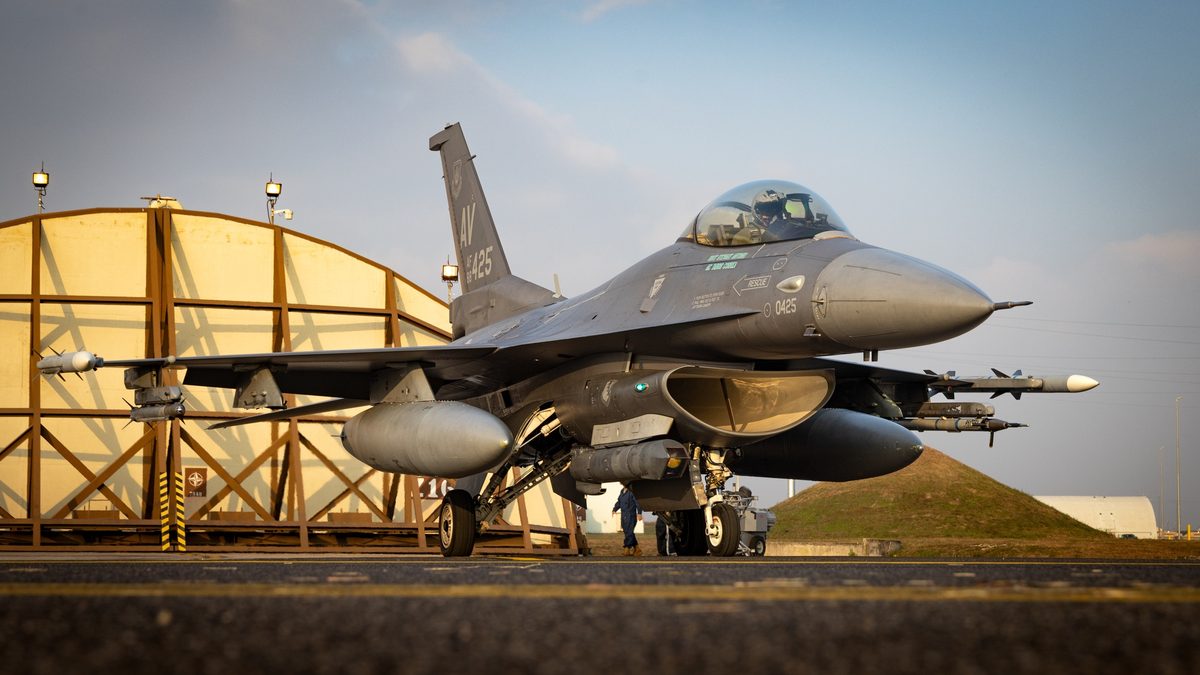 F-16 Fighting Falcon pilot in cockpit preparing for flight at Aviano Air Base, Italy