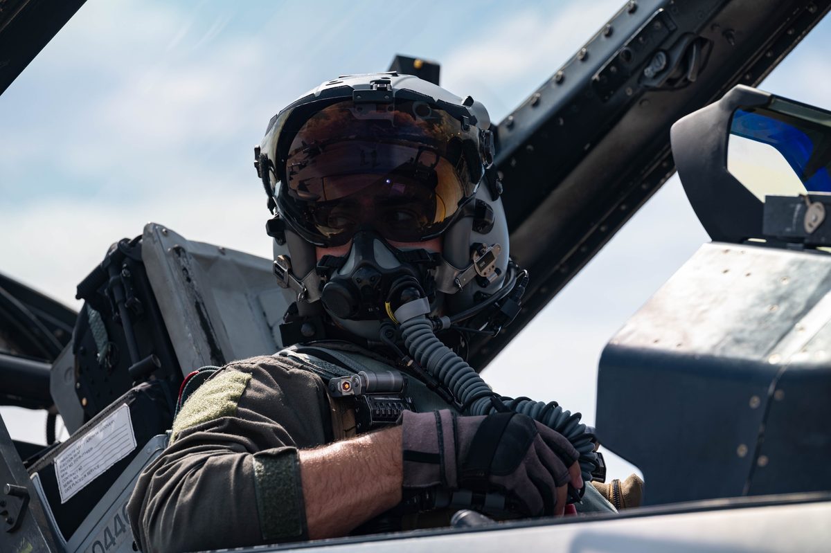 F-16 Fighting Falcon pilot walking toward his aircraft on the flight line at Aviano Air Base