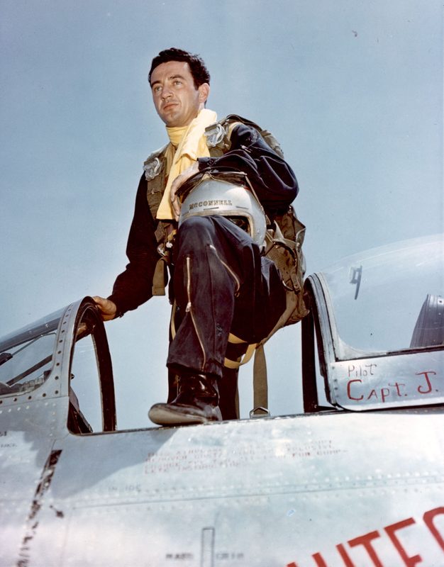 Captain Joseph McConnell, top American ace of the Korean War, climbing into his F-86 Sabre